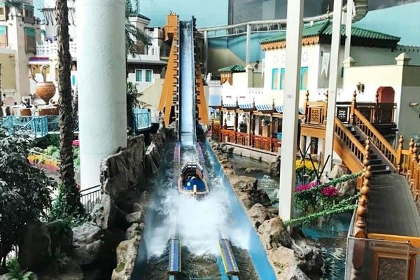 Visitors enjoying attractions inside Lotte World Adventure
