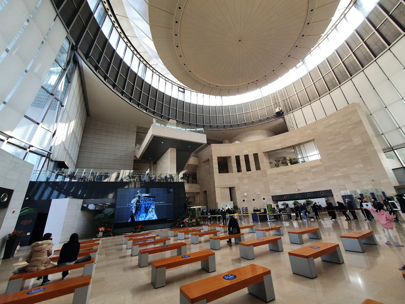 Visitors exploring exhibits inside the National Museum of Korea