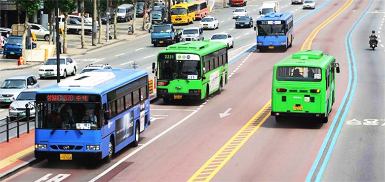 Seoul city buses in blue and green colors at a downtown stop