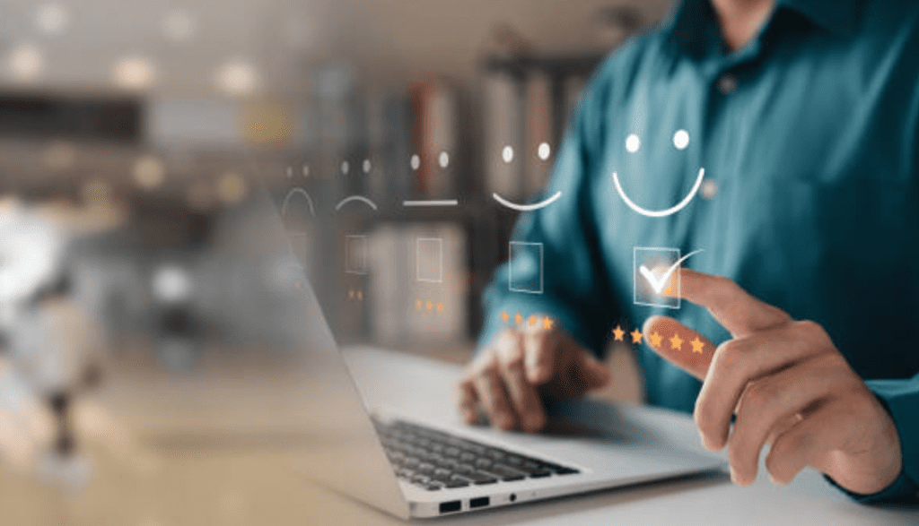 User leaving positive online review with satisfaction icons